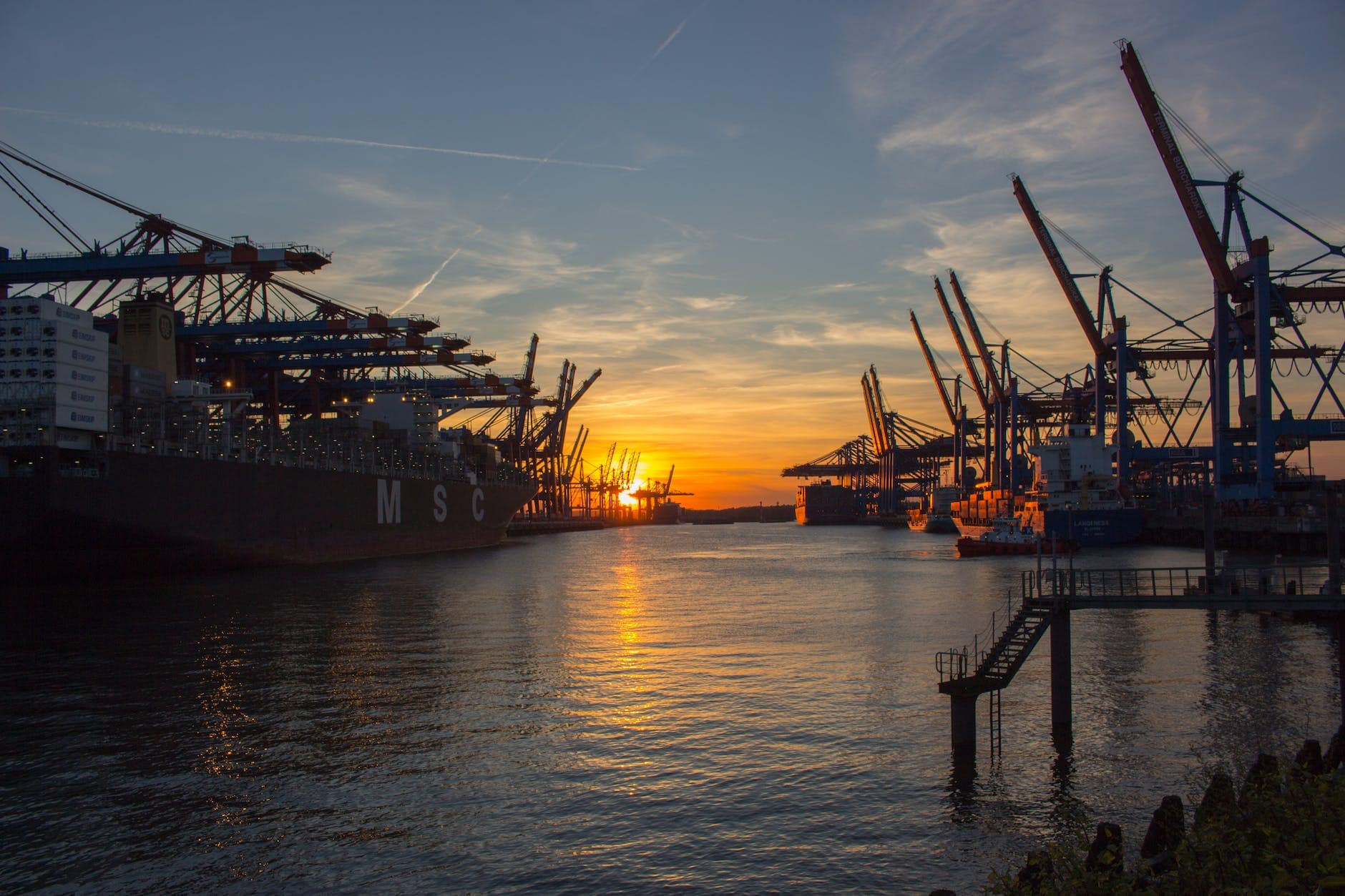 low saturated photo of oil rig during golden hour