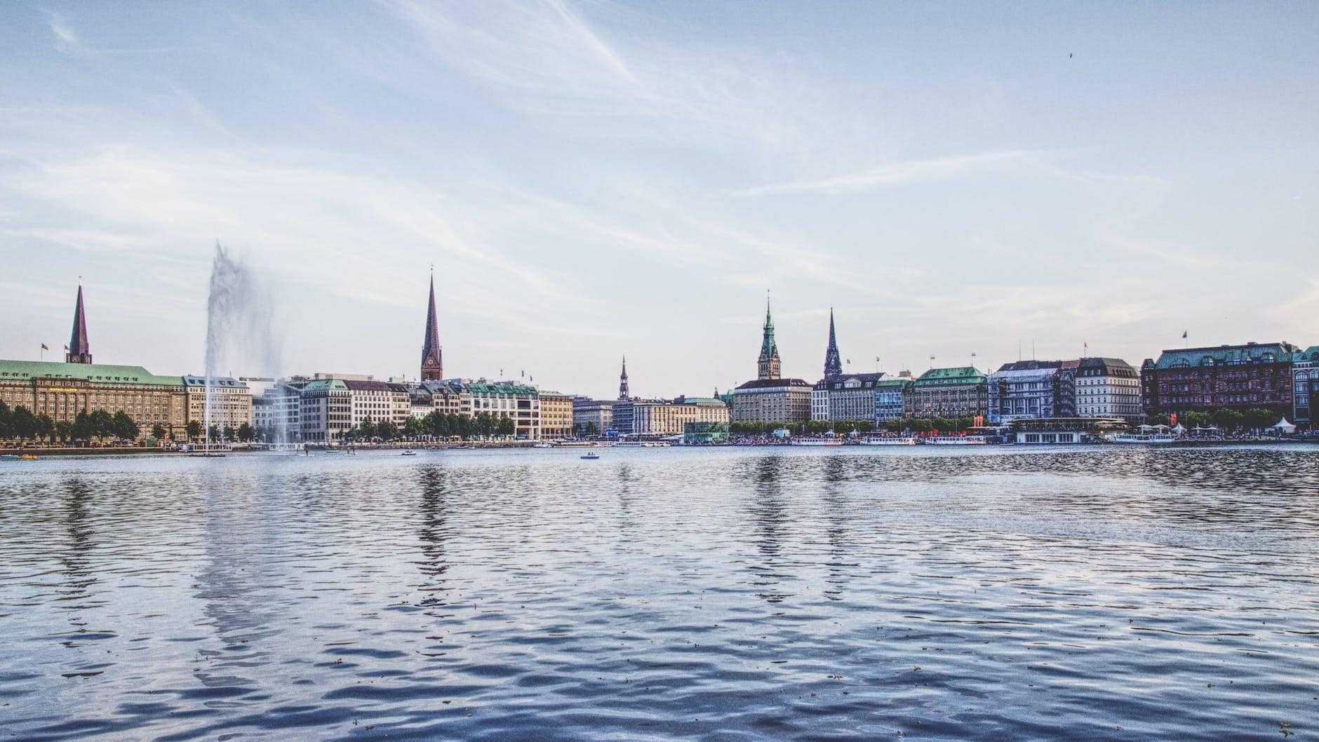 lake with fountain in city